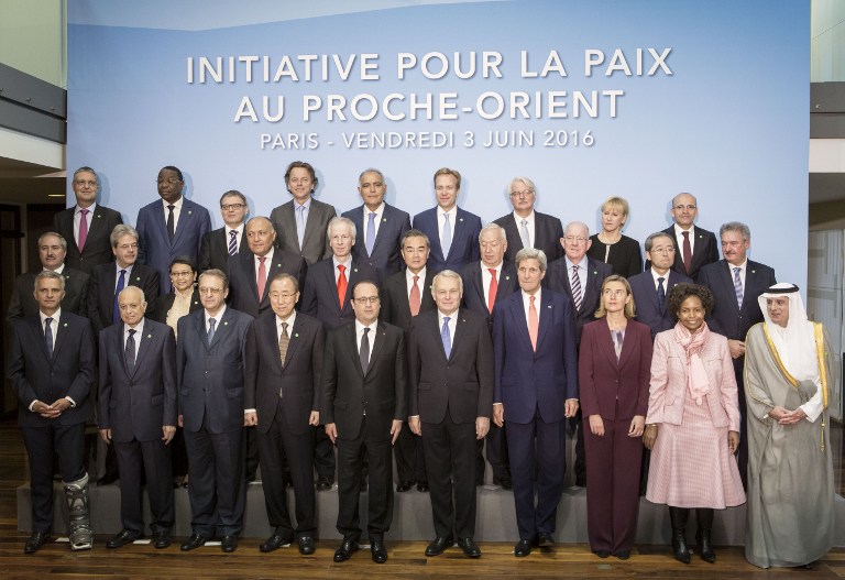 French President Francois Hollande (C), United Nations Secretary General Ban Ki-moon (C-L), French Foreign Minister Jean-Marc Ayrault (C-R), US Secretary of State John Kerry (4th R), European Union High Representative for Foreign Affairs, Federica Mogherini (3rd R) and officials pose for a group photo at an international meeting in a bid to revive the Israeli-Palestinian peace process in Paris, on June 3, 2016. (AFP Photo/Pool/Kamil Zihnioglu)