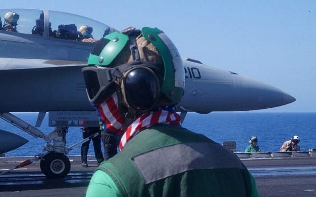 US Navy sailors prepare to catapult launch a fighter jet from the deck of the USS Harry S. Truman aircraft carrier in the Eastern Mediterranean on June 7, 2016. US planes operating from an aircraft carrier in the eastern Mediterranean have mounted at least 35 air strikes on Islamic State jihadists since relocating last week from the Gulf, officers on board told AFP on JUne 7, 2016. (AFP PHOTO / Angus MACKINNON)