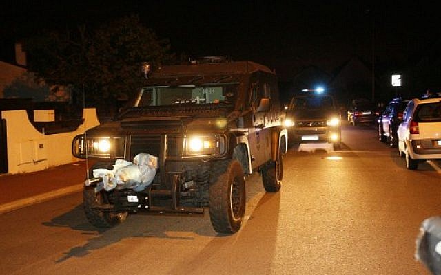 A French special forces RAID vehicle leaves after an assault in Magnanville,  west of Paris, June 14, 2016. (AFP/MATTHIEU ALEXANDRE)