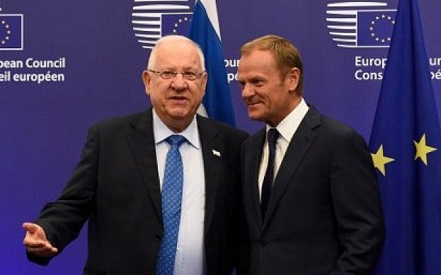 European Union President Donald Tusk, right, welcomes Israeli President President Reuven Rivlin before  their meeting at the EU headquarters in Brussels, June 21, 2016.   (AFP/JOHN THYS)