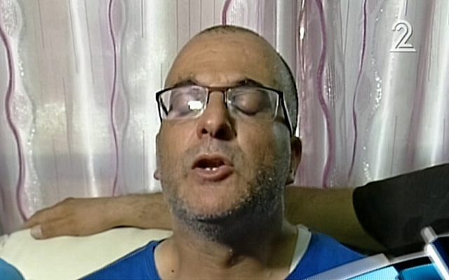 Qassem Asadi, whose two children died of heatstroke after he forgot them in the car, talks to reporters a day after their death, Thursday, June 23, 2016 (screen capture: Channel 2)