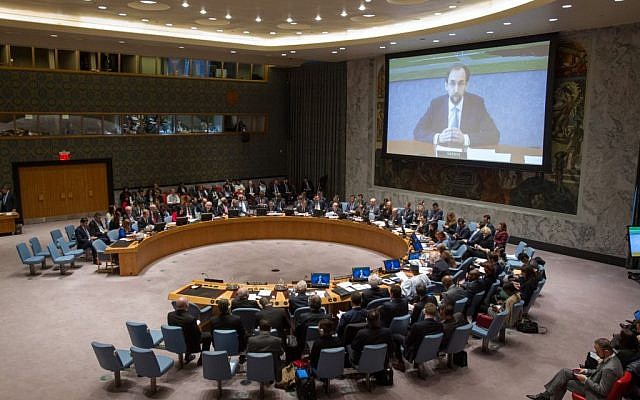 The Security Council Chamber as Zeid Ra’ad Al-Hussein (shown on screen), UN High Commissioner for Human Rights, addresses via video conference the Council's open debate on the victims of attacks and abuses on ethnic or religious grounds in the Middle East on March 27, 2015, in New York. (UN photo)