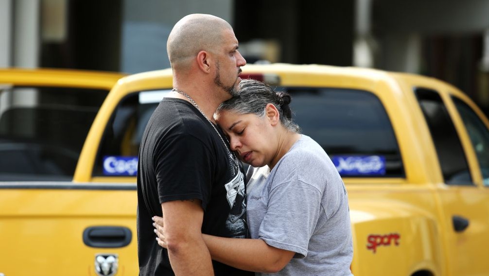 Ray Rivera, left, a DJ at Pulse Orlando nightclub, is consoled by a friend, outside of the Orlando Police Department after a shooting involving multiple fatalities at the nightclub, Sunday, June 12, 2016, in Orlando, Fla. (Joe Burbank/Orlando Sentinel via AP)