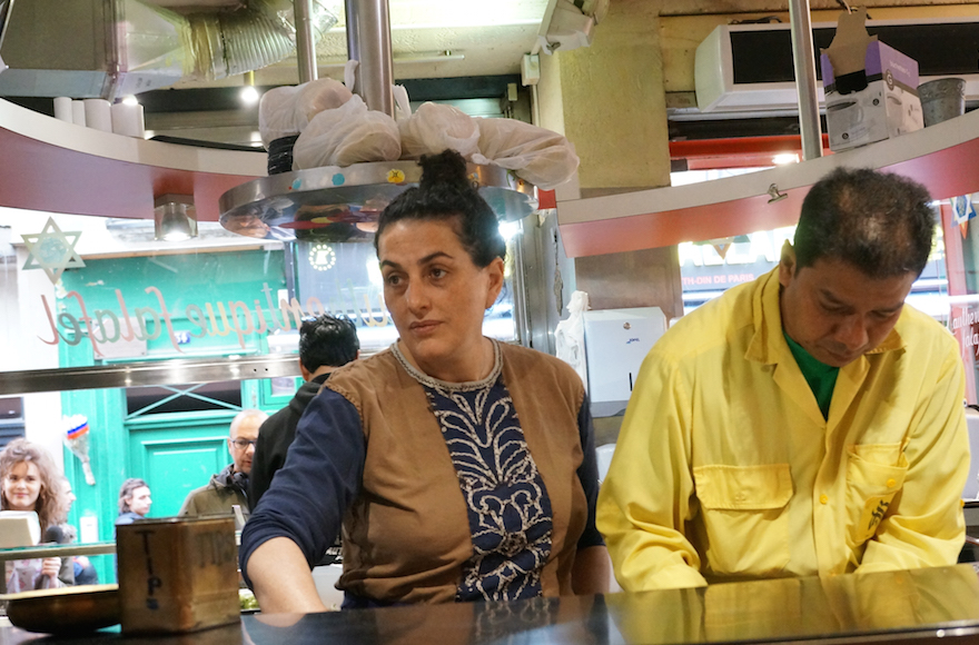 Martine Ouaknine, left, with an employee of her Mi-Va-Mi falafel shop in the historical Jewish quarter of Paris, May 18, 2016. (Cnaan Liphshiz)