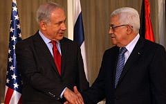 Prime Minister Benjamin Netanyahu (left) shakes hands with Palestinian Authority President Mahmoud Abbas in Jerusalem, September 15, 2010. (Kobi Gideon/Flash90)