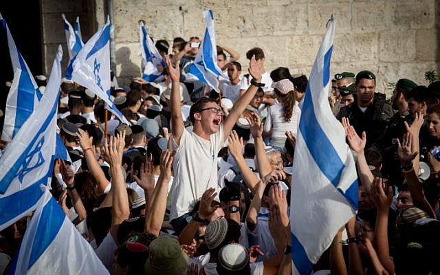 Illustrative: Thousands of young Jewish boys wave Israeli flags as they celebrate Jerusalem Day, dancing and marching their way through Damascus Gate on the way to the Western Wall of Jerusalem's Old City, June 5, 2016. (Nati Shohat/Flash90)
