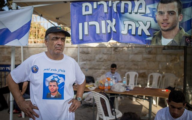 Herzl Shaul, father of late Israeli soldier Oron Shaul, stands at the protest tent outside the Prime Minister's Residence in Jerusalem on June 26, 2016 (Yonatan Sindel/Flash90)