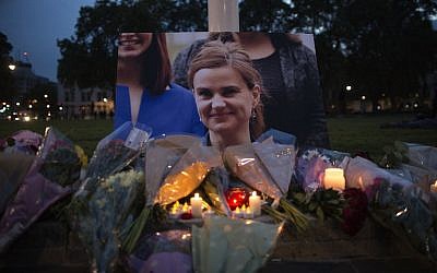Flowers surrounding a picture of Jo Cox during a vigil in Parliament Square in London, England, June 16, 2016. (JTA/Dan Kitwood/Getty Images)