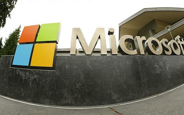 This July 3, 2014 photo shows the Microsoft Corp. logo outside the Microsoft Visitor Center in Redmond, Washington. (AP Photo/Ted S. Warren/File)