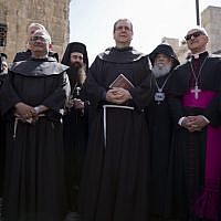 The new Custos of the Catholic Church's properties in the Holy Land Italian Franciscan priest Rev. Francesco Patton, center, stands during a procession in Jerusalem's Old City, Monday, June 6, 2016. (AP Photo/Ariel Schalit)