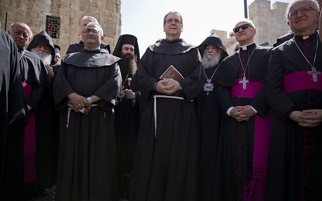The new Custos of the Catholic Church's properties in the Holy Land Italian Franciscan priest Rev. Francesco Patton, center, stands during a procession in Jerusalem's Old City, Monday, June 6, 2016. (AP Photo/Ariel Schalit)