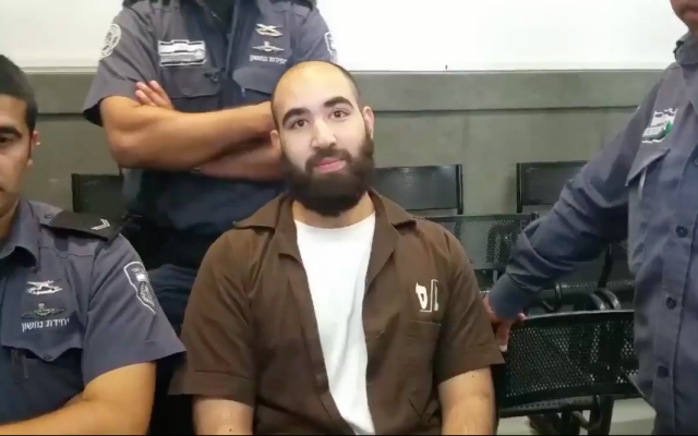 Ibrahim Hassan Yussef Ighbariah pictured in a Haifa District Court on June 29, 2016, wheh he was on trial for trying to join the Islamic State in Syria. (Screen capture: Twitter)