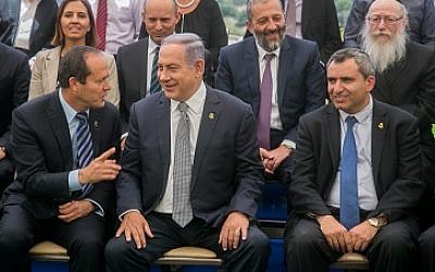 Prime Minister Benjamin Netanyahu (center) speaks with Jerusalem Mayor Nir Barkat (left) during a special cabinet meeting for Jerusalem Day at the Ein Lavan spring in Jerusalem on June 2, 2016. (Marc Israel Sellem/POOL)