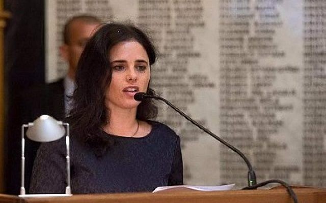 Justice Minister Ayelet Shaked at the Budapest Bar Association in front of a memorial wall carrying the names of Jewish lawyers from the city who were murdered during the Holocaust, June 6, 2016 (via Facebook)