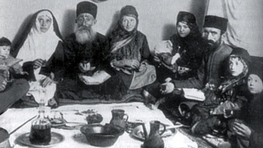 Late-19th century photograph of a family from Quba, near Krasnaya Sloboda celebrating the Passover holiday. (Krasnaya Sloboda archives)