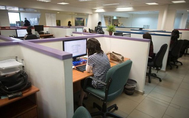 Ultra-Orthodox Jewish women work on computers in the Comax software company office in the central city of Holon near Tel Aviv on April 17, 2016. (AFP PHOTO / MENAHEM KAHANA )