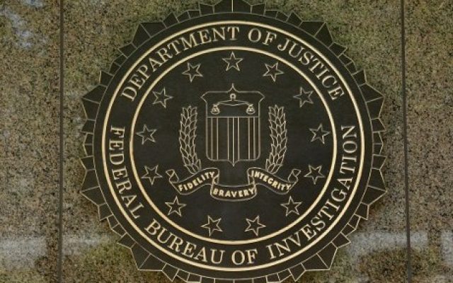 The FBI logo is seen outside the headquarters building in Washington, DC on July 5, 2016. (AFP Photo/Yuri Gripas)
