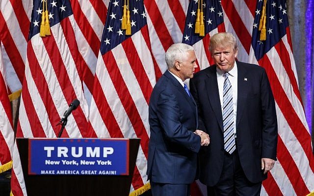 US Republican presidential candidate Donald Trump (R) shakes hands with vice presidential candidate Mike Pence on July 16, 2016, during a press conference in New York. (AFP PHOTO/KENA BETANCUR)