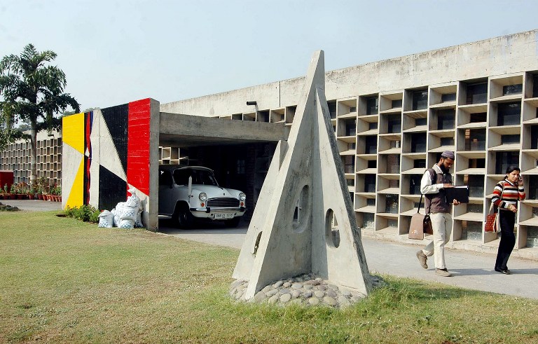 Indian students walk through the Government Arts College, designed by Le Corbusier, in the Indian city of Chandigarh. UNESCO on July 17, 2016, listed Franco-Swiss architect Le Corbusier's works among its World Heritage Sites. (AFP PHOTO / NARINDER NANU)