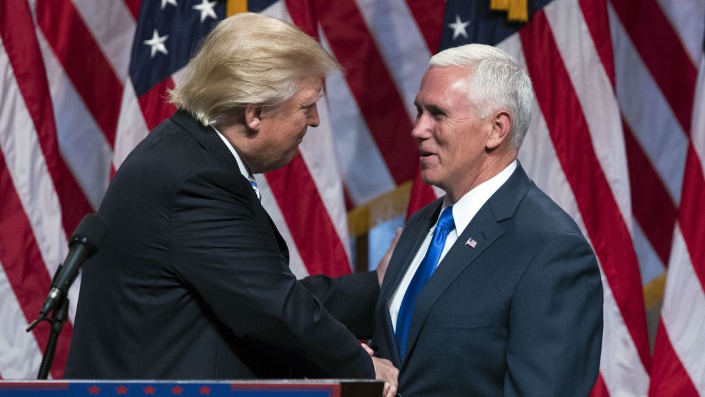 Republican presidential candidate Donald Trump, left, shakes hands with Gov. Mike Pence, R-Indiana, during a campaign event to announce Pence as his vice presidential running mate on Saturday, July 16, 2016, in New York. (AP Photo/Evan Vucci)