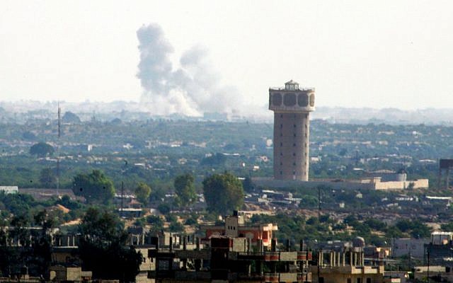 Smoke rises after an airstrike in the Sinai city of Rafah as seen from Gaza on July 1, 2015. (Abed Rahim Khatib /Flash90)