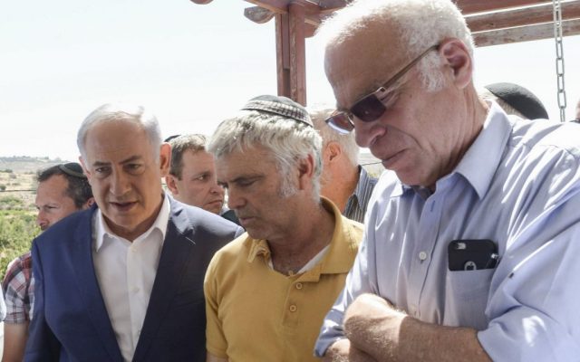 Prime Minister Benjamin Netanyahu on a condolence visit to the Ariel family, in the Jewish settlement of Kiryat Arba, in the West Bank, on July 1, 2016. At center is Avichai Ariel, and at right is Agriculture Minister Uri Ariel. A 17-year-old Palestinian terrorist broke into their home and stabbed and killed 13-year-old Hallel in her bedroom on June 30, 21016. (Amos Ben Gershom/GPO)