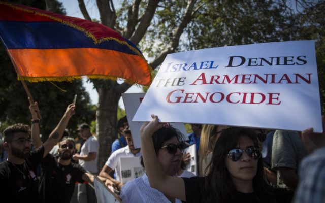 Members of the Jerusalem Armenian community protest outside the Knesset following the Israeli government's recent diplomatic agreement with Turkey, demanding that the State of Israel finally recognize the Armenian Genocide, July 5, 2016 (Hadas Parush/Flash90)