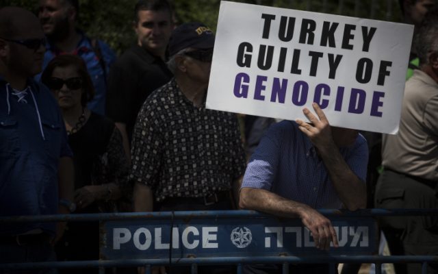 Members of the Jerusalem Armenian community protest outside the Knesset following the Israeli government's recent diplomatic agreement with Turkey, demanding that the State of Israel finally recognize the Armenian Genocide, July 5, 2016 (Hadas Parush/Flash90)