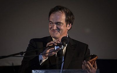 Quentin Tarantino speaks after receiving an award at the opening night of the Jerusalem Film Festival, at Sultan's Pool near the Old City of Jerusalem, on July 7, 2016. (Hadas Parush/Flash90)
