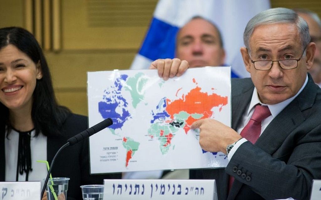 Prime Minister Benjamin Netanyahu shows his map of Israel's world relations, at a session of the Knesset State Control Committee, on July 25, 2016. To his side is committee chair Karin Elharar of Yesh Atid. (Yonatan Sindel/Flash90)