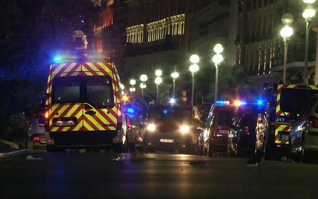 In this video grab taken Thursday July 14, 2016, ambulances and police cars are seen after a truck drove on to the sidewalk and plowed through a crowd of revelers who’d gathered to watch the fireworks in the French resort city of Nice. (BFMTV via AP)