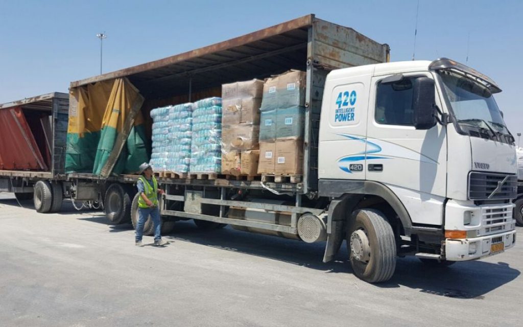 A truck laden with humanitarian aid from Turkey enters the Gaza Strip via the Kerem Shalom crossing on Monday, July 4, 2016 (Defense Ministry)