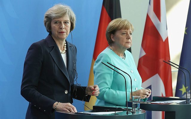 British Prime Minister Theresa May, left, and German Chancellor Angela Merkel speaking to the media following talks at the Chancellery in Berlin, July 20, 2016. (Sean Gallup/Getty Images/via JTA)