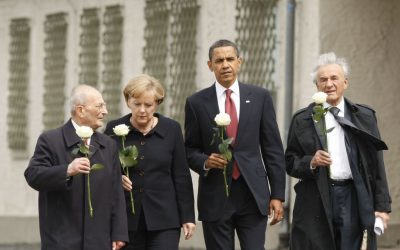 In this June 5, 2009 file photo, U.S. President Barack Obama tours the Buchenwald concentration camp in Buchenwald, Germany. From left are, Holocaust survivor Bertrand Herz, German Chancellor Angela Merkel, the president and Elie Wiesel. (AP Photo/Gerald Herbert)