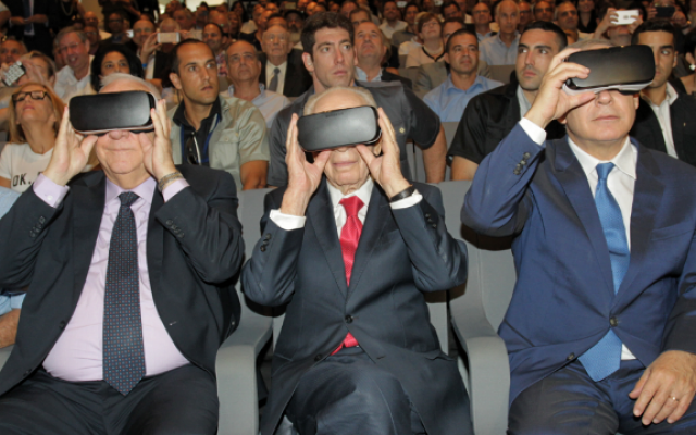 From left: Reuven Rivlin, Shimon Peres, Benjamin Netanyahu try on VR headsets at innovation center event, July 21, 2016 (Courtesy) 