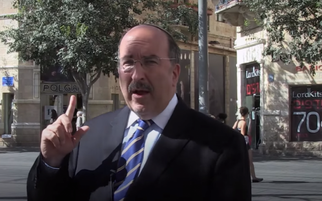 Foreign Ministry director-general Dore Gold standing on Zion Square in Jerusalem, where he witnessed a deadly terror attack in 1975 (screen grab YouTube)
