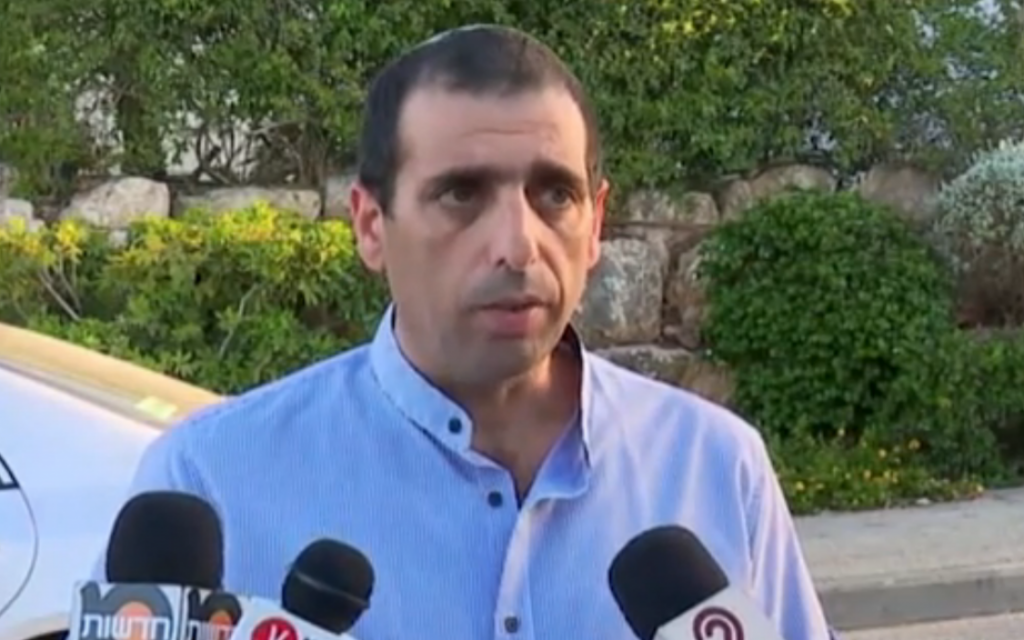 Ofek Buchris speaks to reporters outside his Galilee home after an indictment was filed against him, charging the brigadier general with rape, sodomy and other indecent acts on July 21, 2016. (Screen capture: Walla news)