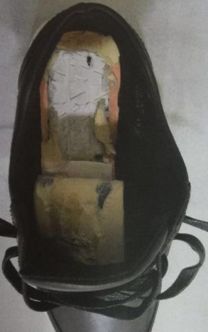 A pair of shoes with a hidden compartment for smuggling money that were confiscated by Israeli security forces at the Erez Crossing into the Gaza Strip in June 2016. (Shin Bet)