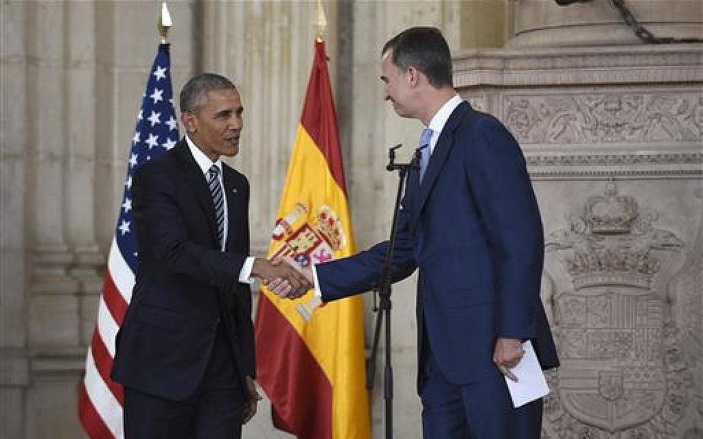 US President Barack Obama shakes hands with Spain's King Felipe VI at the Palacio Real de Madrid in Madrid on July 10, 2016. (AP Photo/Susan Walsh)