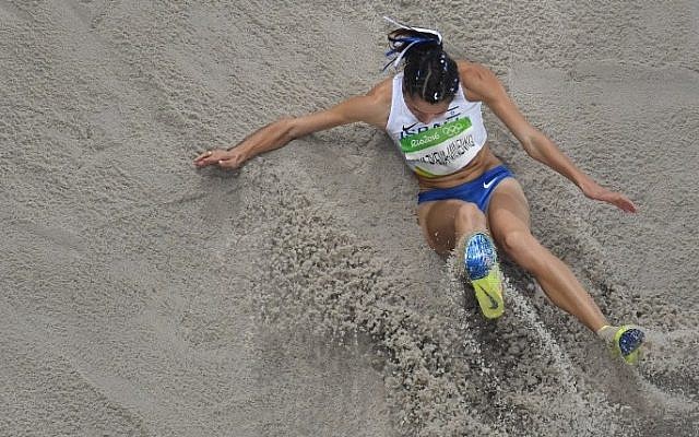 Israel's Hanna Knyazyeva-Minenko competes in the Women's Triple Jump Final during the athletics event at the Rio 2016 Olympic Games at the Olympic Stadium in Rio de Janeiro on August 14, 2016.  (AFP/ Antonin THUILLIER)