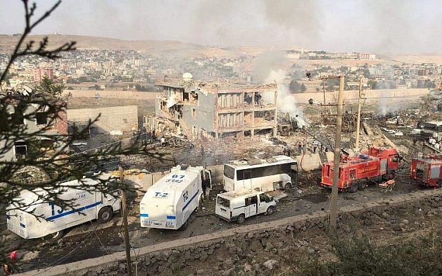 Illustrative photo of Turkish police and firefighters near a damaged police headquarters after a car bomb killed eleven Turkish police officers and injured 45 people on August 26, 2016 in Cizre, southeastern Turkey, an attack blamed on Kurdish militants, state media said. (AFP/Dogan News Agency/STR)