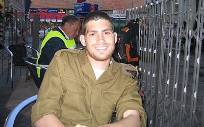 Michael Levin receives a package of Tastykakes, soon after he was drafted into the IDF, on March 20, 2005. (Tami Gross)