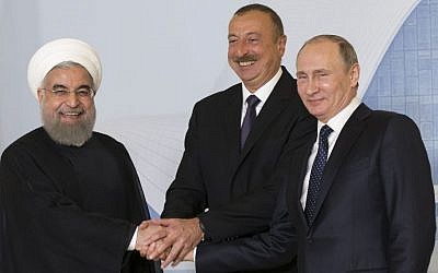 Iranian President Hassan Rouhani, left, Azerbaijan's President Ilham Aliyev, center, and Russian President Vladimir Putin pose for a photo during their meeting in Baku, Azerbaijan, August 8, 2016. (AP/Alexander Zemlianichenko, pool) 