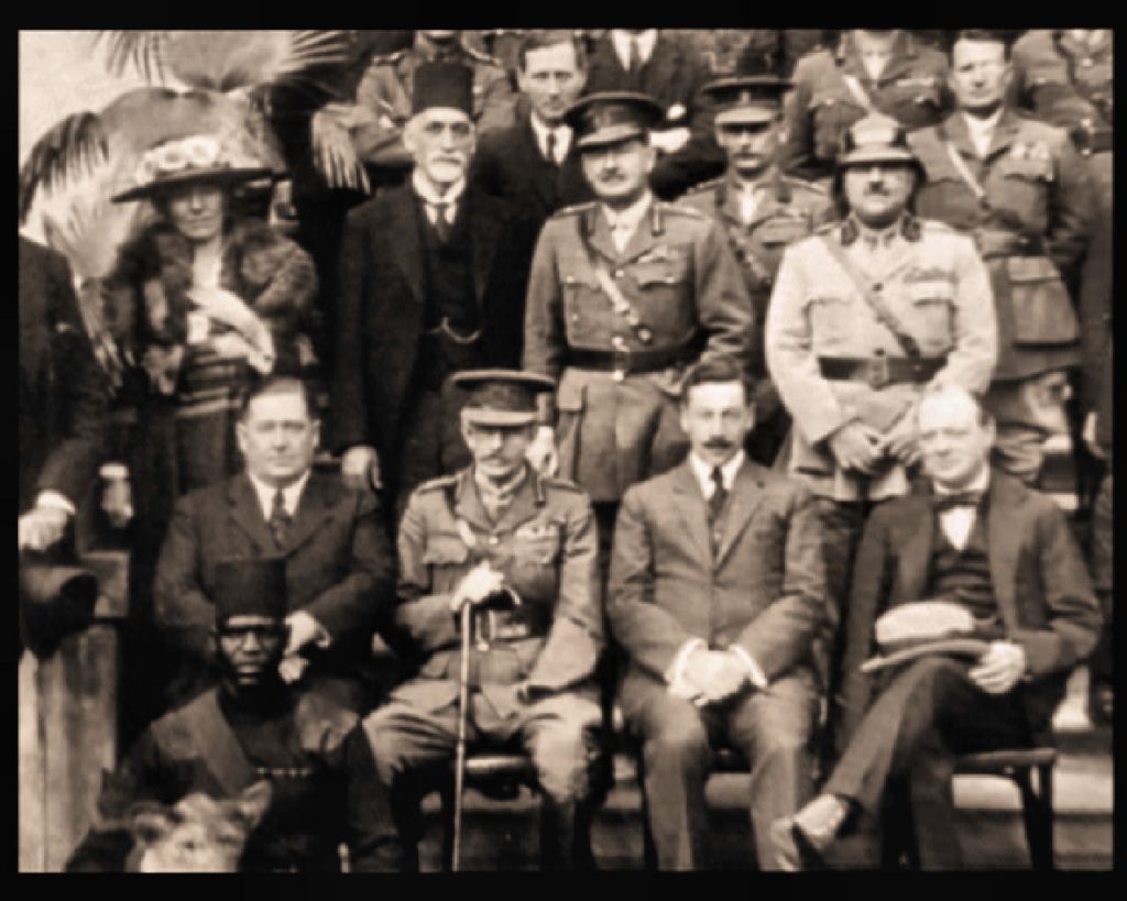 Photo taken at the Cairo Conference- 1921. Seated: from right: Winston Churchill, Herbert Samuel. Standing first row: from left: Gertrude Bell, Sir Sassoon Eskell, Field Marshal Edmund Allenby, Jafar Pasha al-Askari. (Courtesy: wikipedia) 