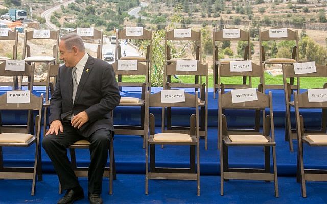 Prime Minister Benjamin Netanyahu waiting for government ministers to join him before a special cabinet meeting for Jerusalem Day in Jerusalem, June 2, 2016. (Marc Israel Sellem/Pool)