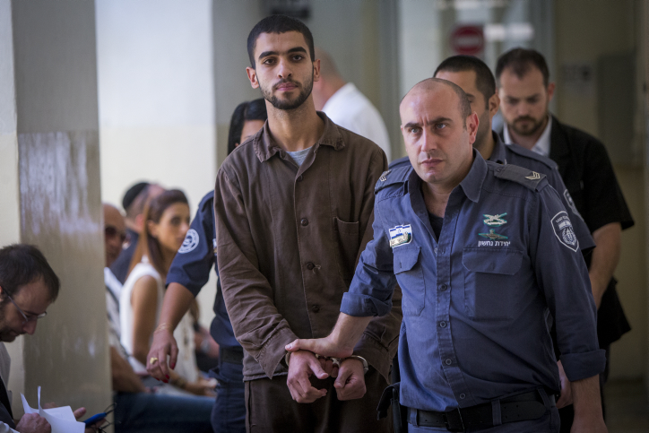 Ali Abu Hassan, a Palestinian student from a village outside of Hebron, walks through a Jerusalem court on August 2, 2016, before being indicted for attempting to carry out a terror attack on the Jerusalem light rail in July. (Yonatan Sindel/Flash90)