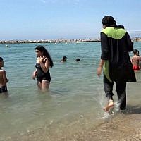 A woman wearing a burkini at the beach in Marseille, southern France. (AP Photo)