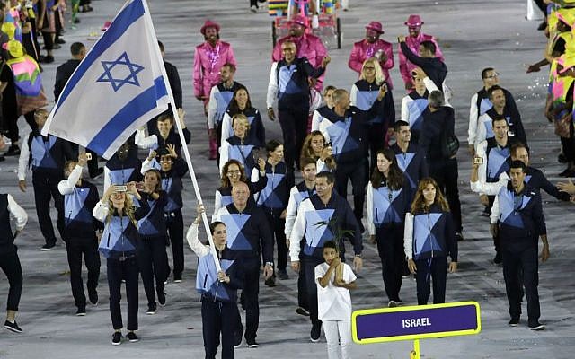 Neta Rivkin carries the flag of Israel during the opening ceremony for the 2016 Summer Olympics in Rio de Janeiro, Brazil, Friday, Aug. 5, 2016. (AP Photo/Matt Slocum)