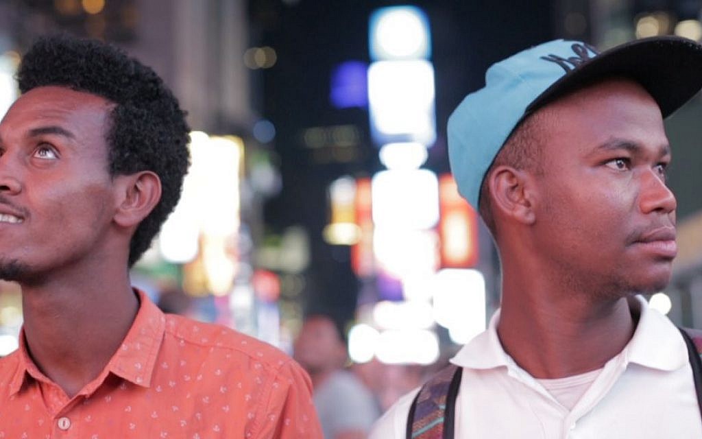 Gezahegn Dereve (left) and Demoz Deboch check out Times Square, NYC on August 6, 2016, on their five week speaking tour through the US to raise awareness about Jews in Ethiopia waiting to move to Israel. (courtesy Ryan Porush)