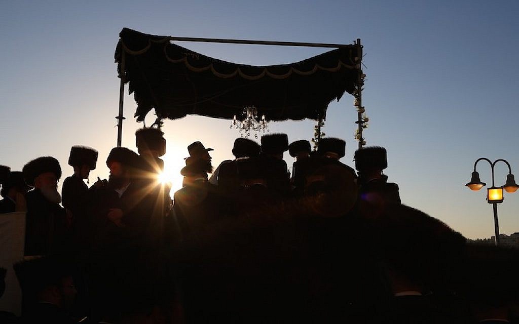 Illustrative: Hasidic Jewish men celebrating a wedding in Israel, where marriage and divorce is legally under the authority of the Orthodox Chief Rabbinate. (Yaakov Lederman/Flash90)